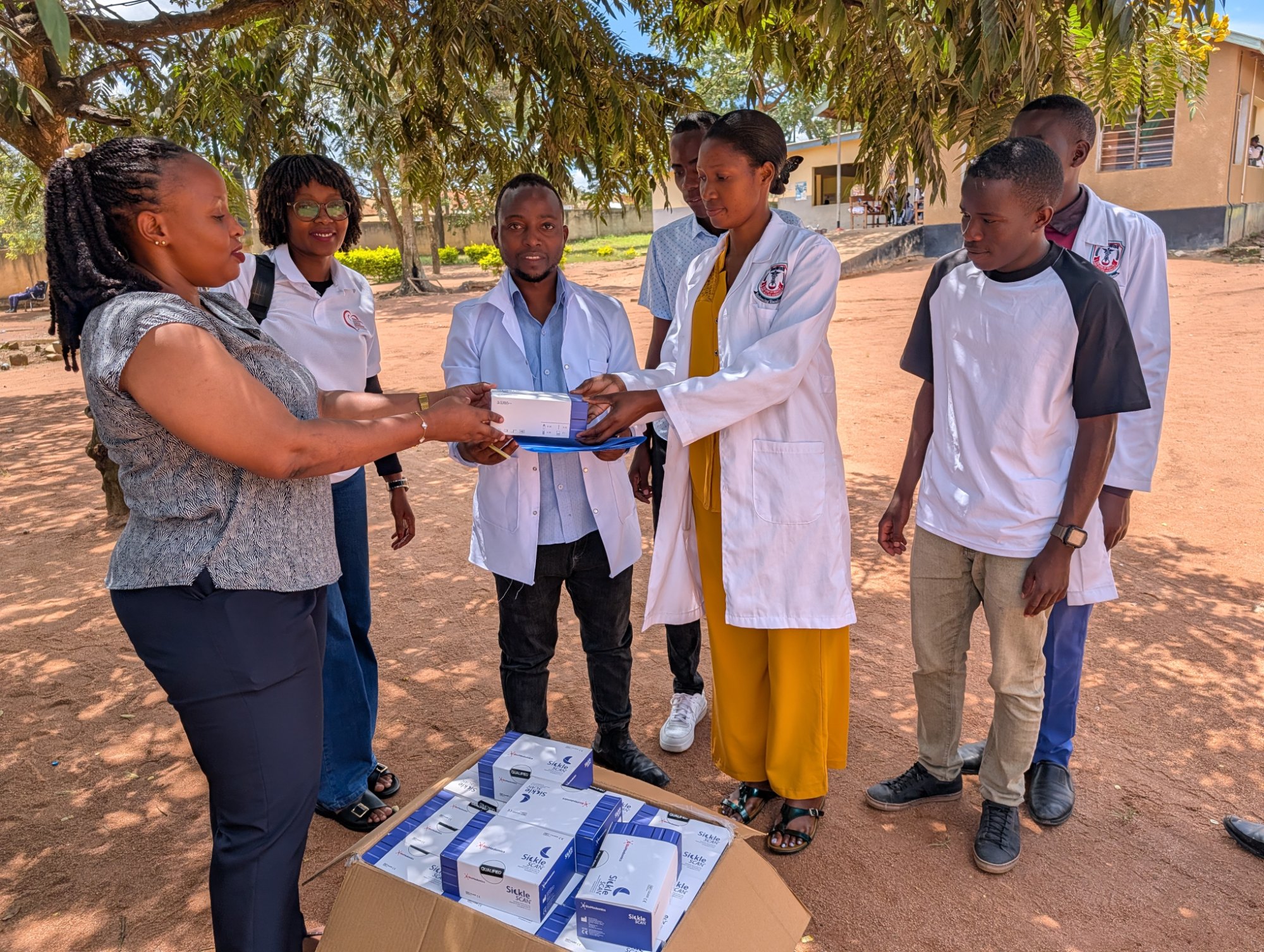KETAN SCD Project Coordinator and Geita Regional NCD Coordinator handing over SickleScan at Katoro Health Centre